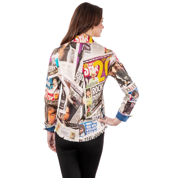 Woman wearing a colorful newspaper print shirt on a white background